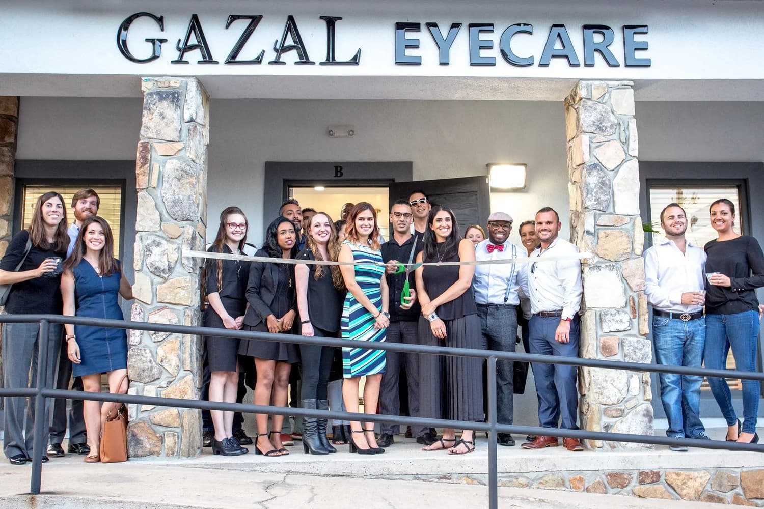 Laura, Alek, Jaime, Sydney, Bethy, Sahile, Garet, Aldina, Andy, Christopher, Gazal, Misty, Danny, Anthony, David, & Laura at the Gazal Eyecare grand opening in Roswell, GA