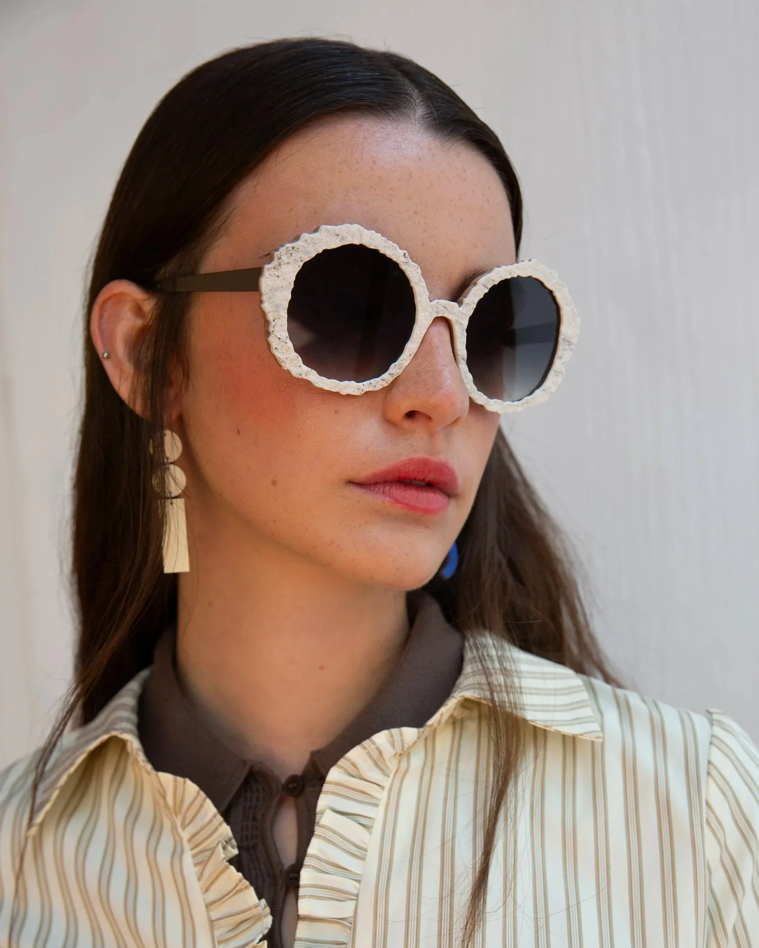 Nina Mûr Galaxy Collection lookbook shot — handcrafted wooden eyewear in cosmic-inspired colorways, available at Gazal Eyecare in Roswell, GA