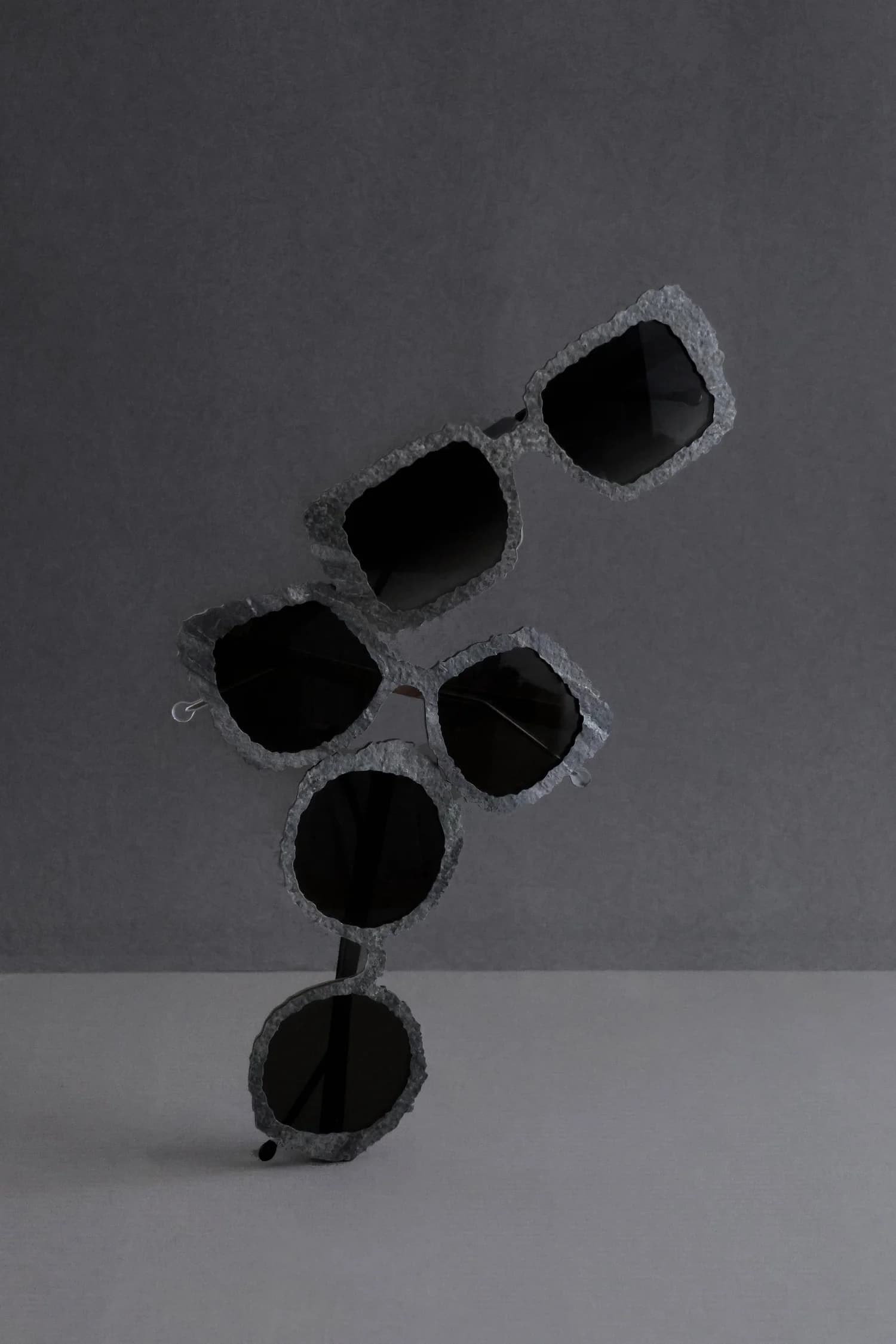 Nina Mûr Galaxy Collection still-life shot in the Mercury colorway — metallic grey and silver wood-laminate eyewear